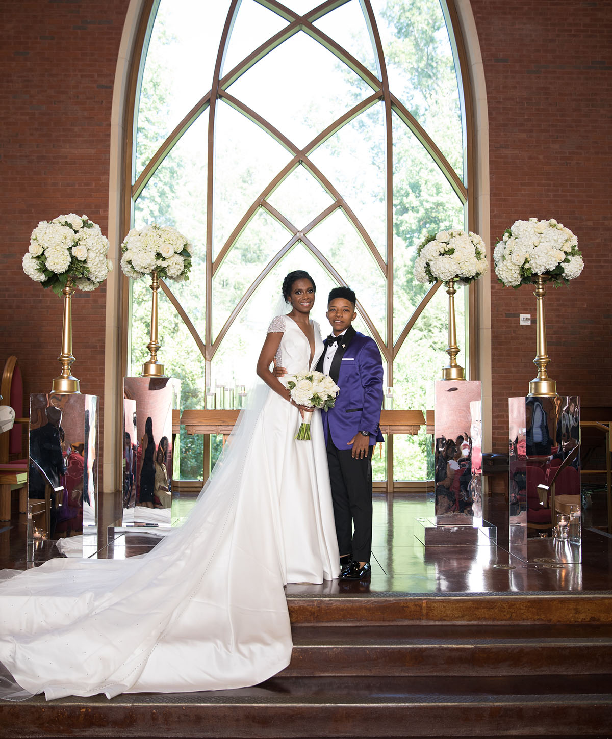 Southern traditional chapel wedding two brides purple tuxedo long white dress church God religious cultural traditions