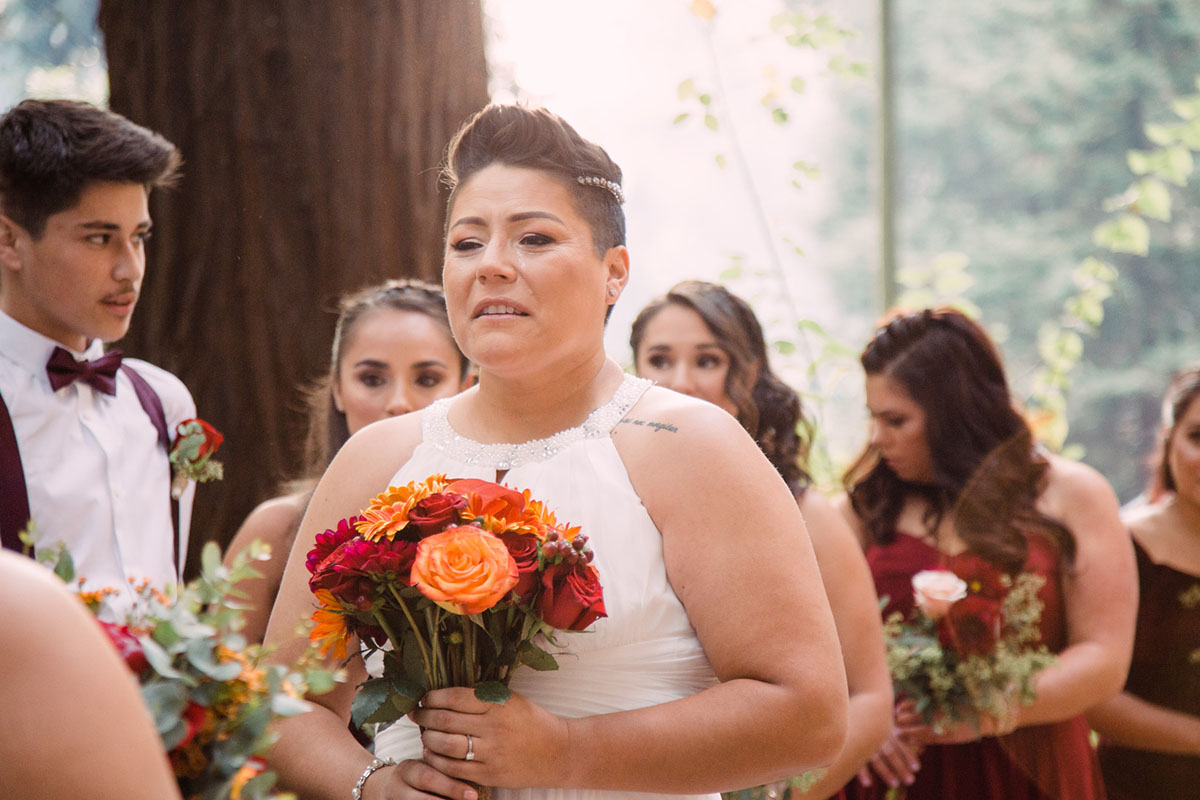 This couple got married in San Francisco during the California wildfires two brides breast cancer survivor white lace dresses first look bouquet