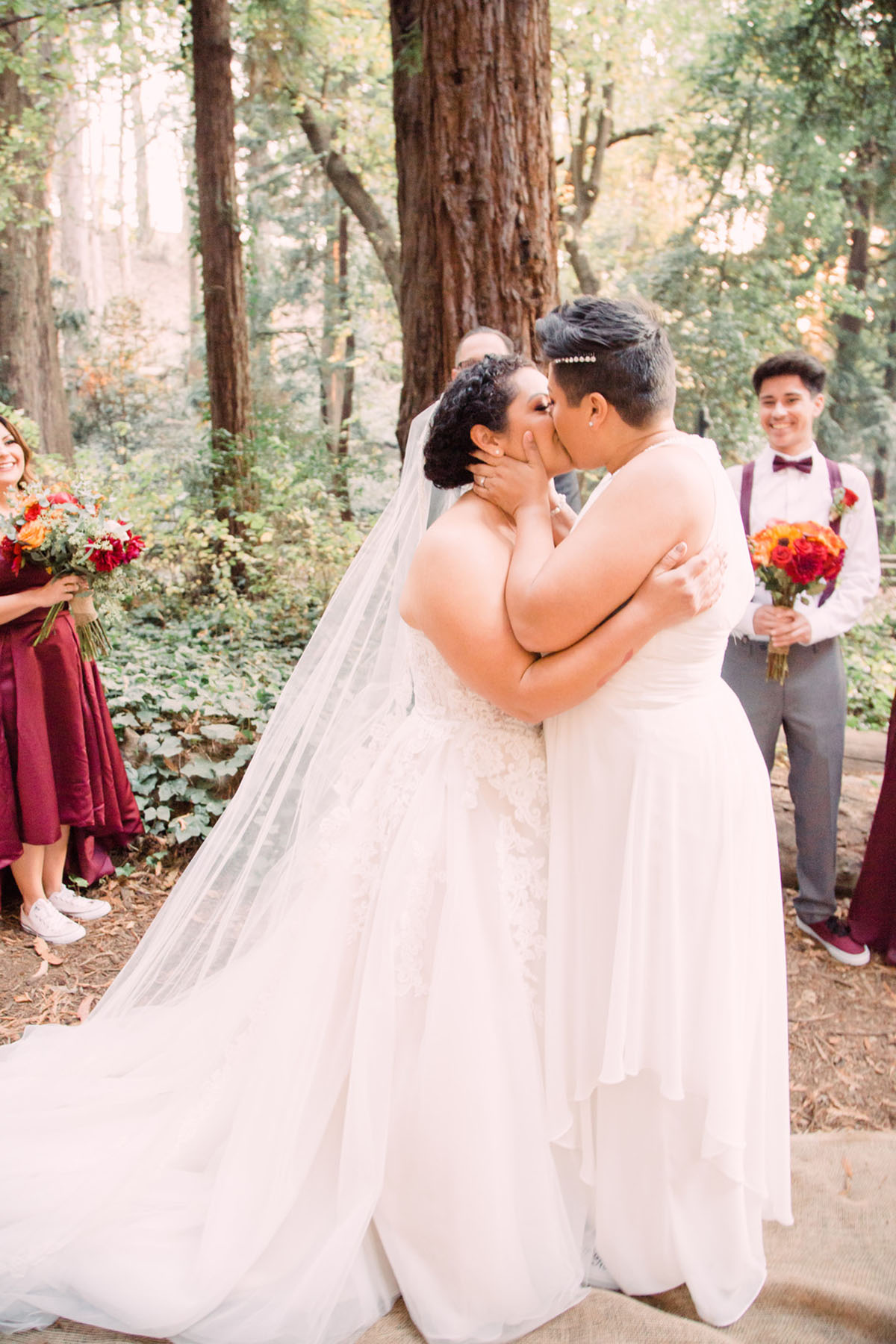 This couple got married in San Francisco during the California wildfires two brides breast cancer survivor white lace dresses kiss