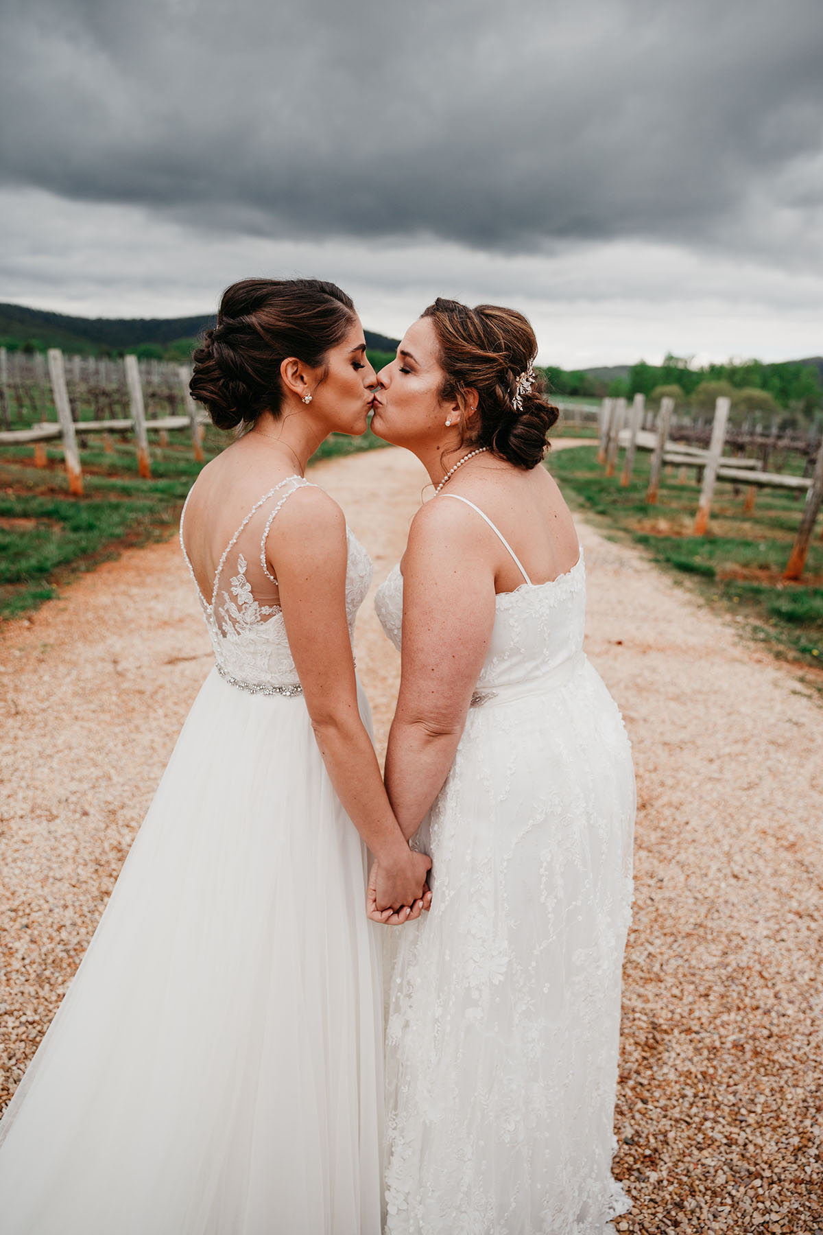 Vintage, romantic vineyard wedding two brides lesbian updos buns white dresses pearlskiss
