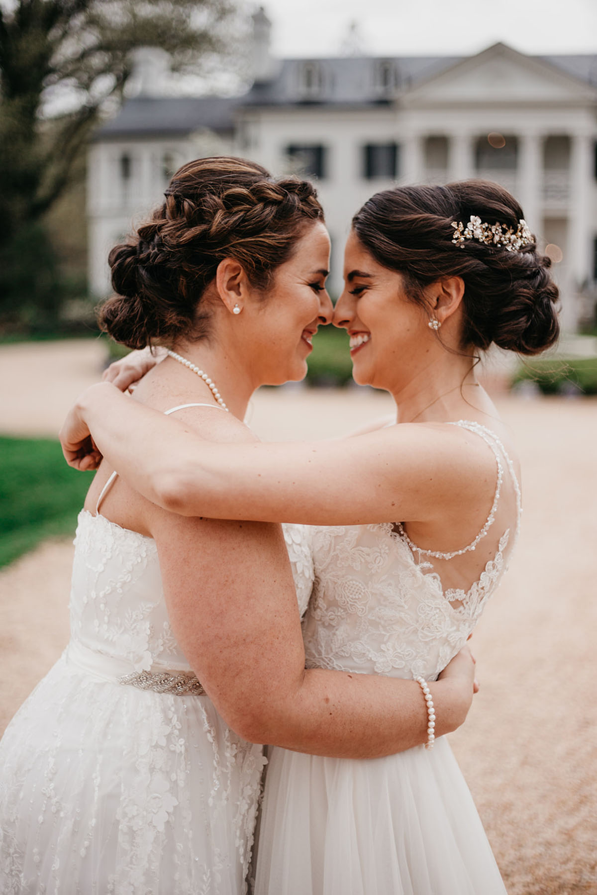 Vintage, romantic vineyard wedding two brides lesbian updos buns white dresses pearls