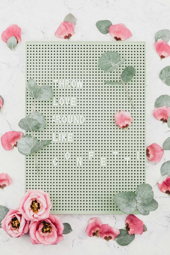 Green letterboard, "Throw love around like confetti." Book more LGBTQ+ weddings by improving your wedding directory listing. Equally Wed
