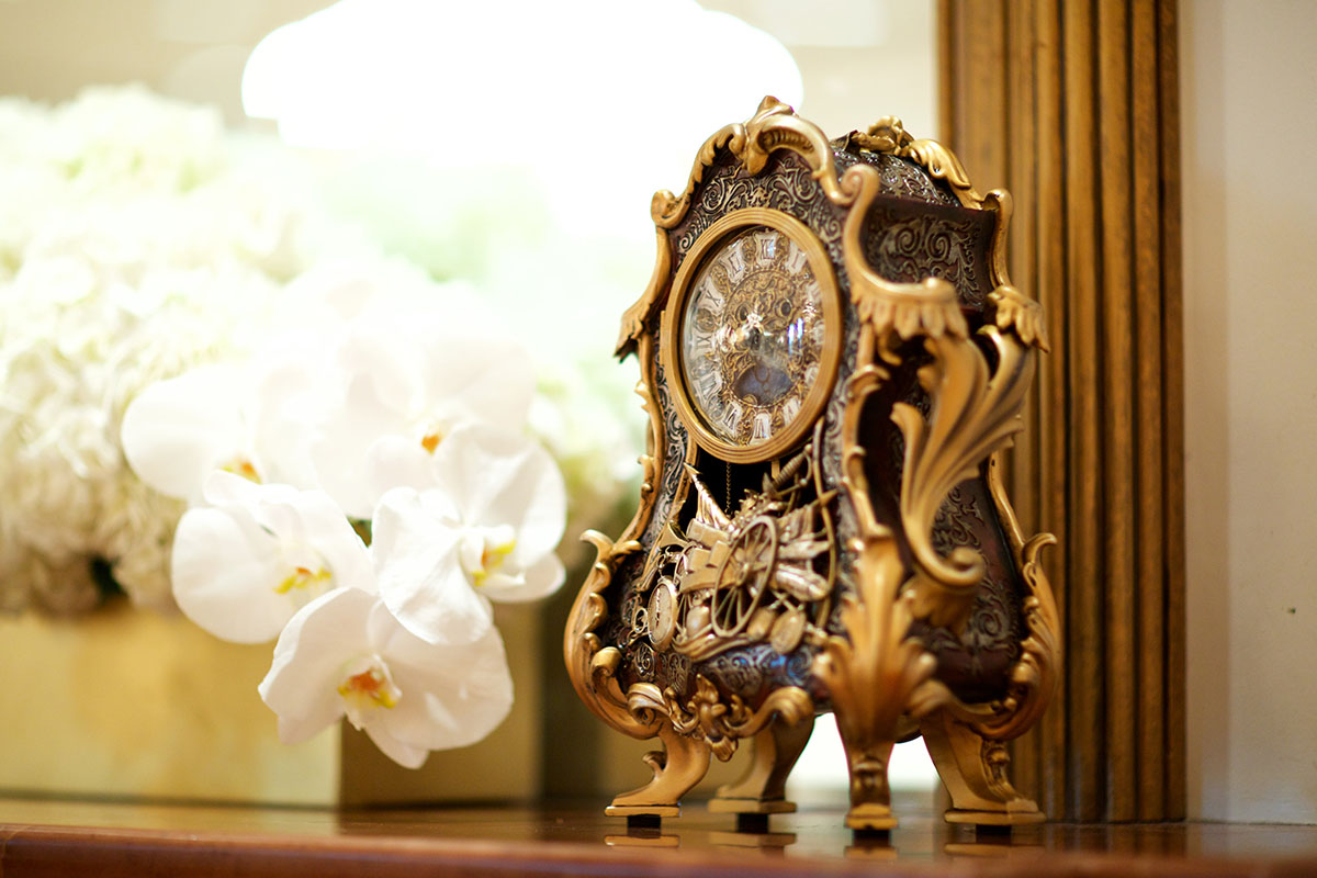 You'll want to a be a guest at this couple's Beauty and the Beast inspired wedding Cogsworth clock