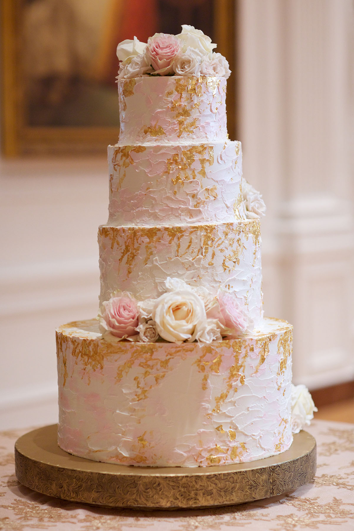 You'll want to a be a guest at this couple's Beauty and the Beast inspired wedding pink and gold leaf cake