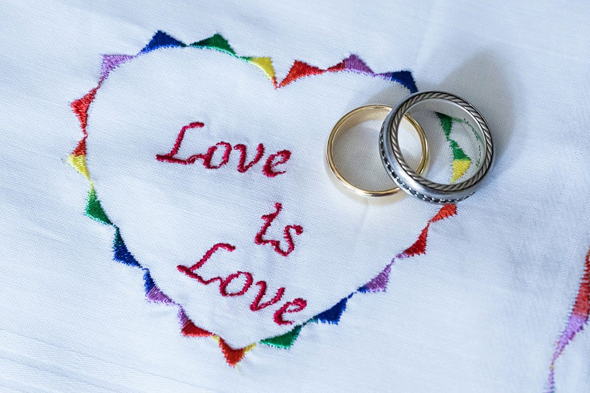 Hawaiian traditional winery wedding rainbow love is love wedding rings bands