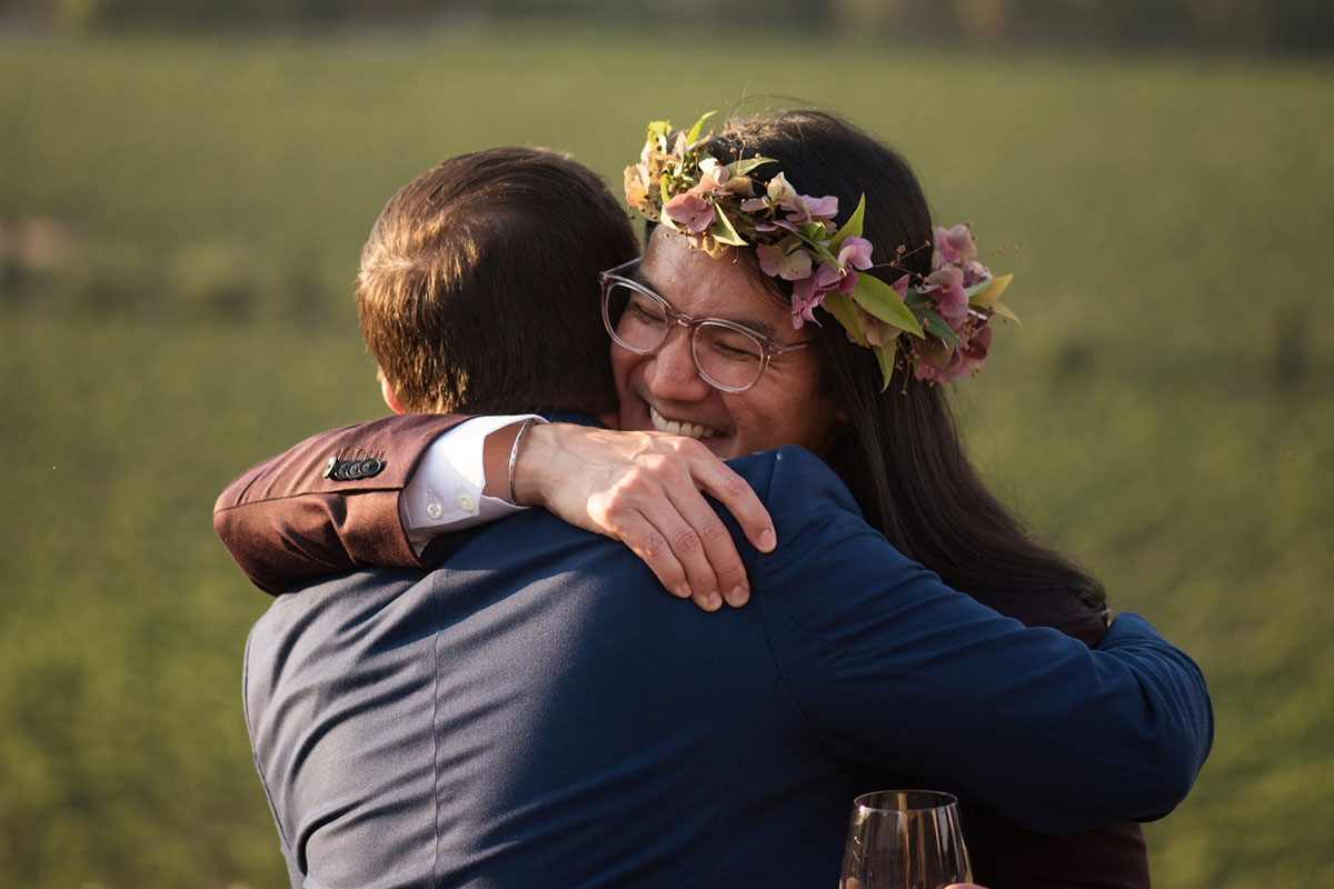 Hawaiian traditional winery wedding leis long hair Sonoma California wine country bow ties purple tux blue tux hug