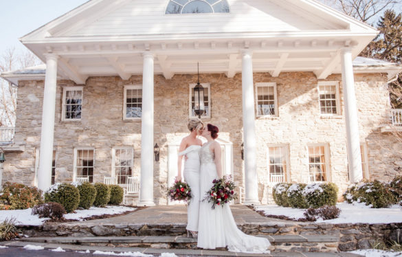 Historic mansion winter wedding inspiration two brides long white dresses up do