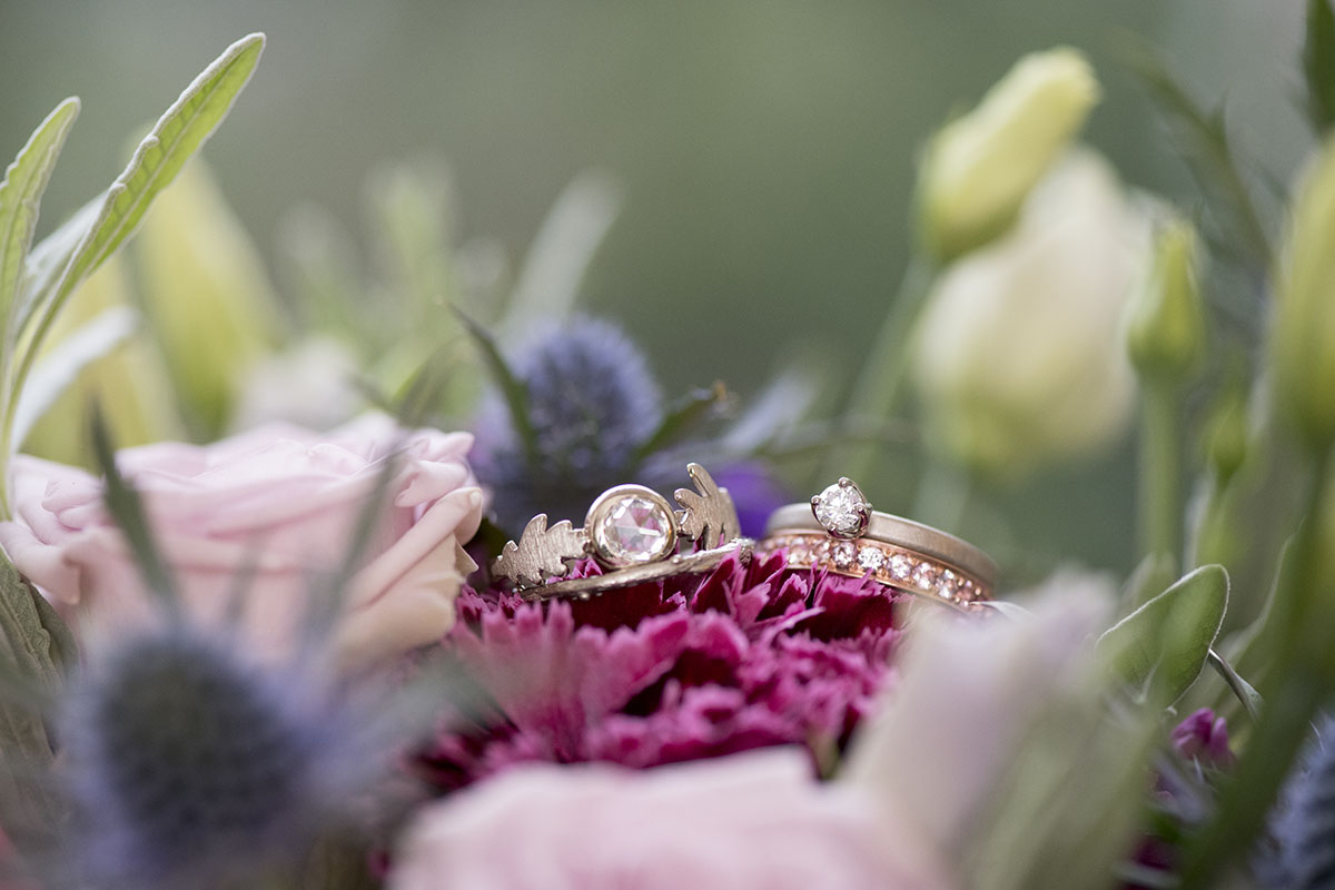 Romantic ivory and purple wedding inspiration wedding rings roses