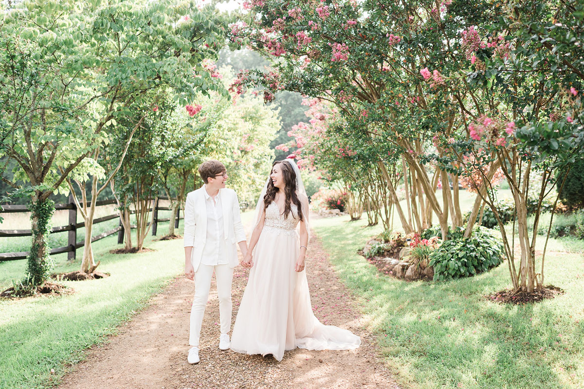 Storybrook Farm wedding in Jonesborough, Tennessee two brides blush dress all white suit flowers outside
