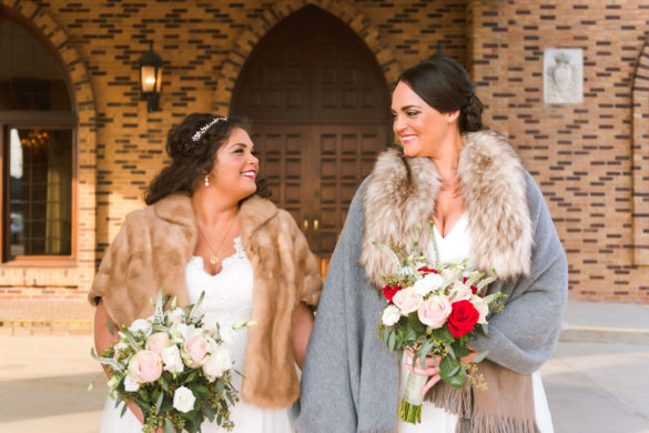 Winter wedding in Troy, Michigan two brides long white dresses flower crowns fur coats