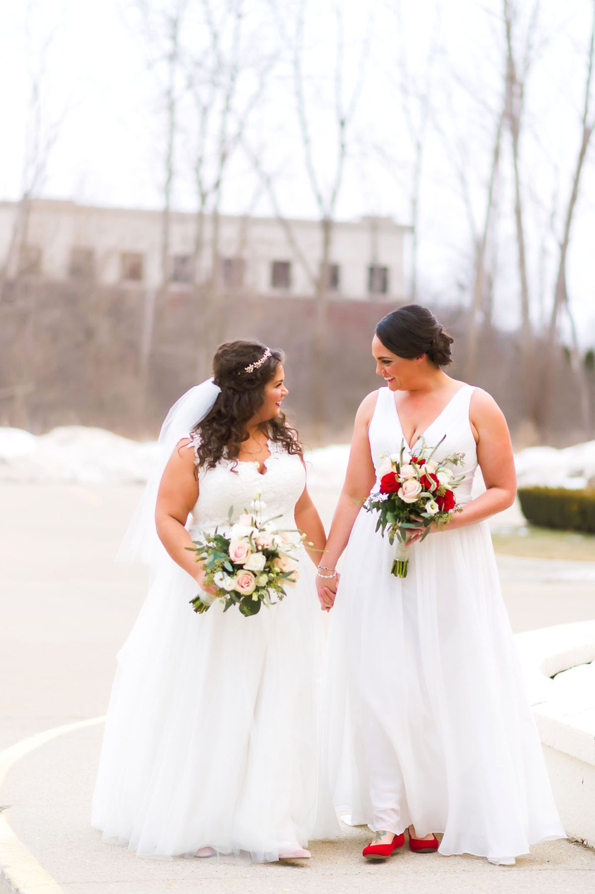 Winter wedding in Troy, Michigan two brides long white dresses flower crowns rose bouquets