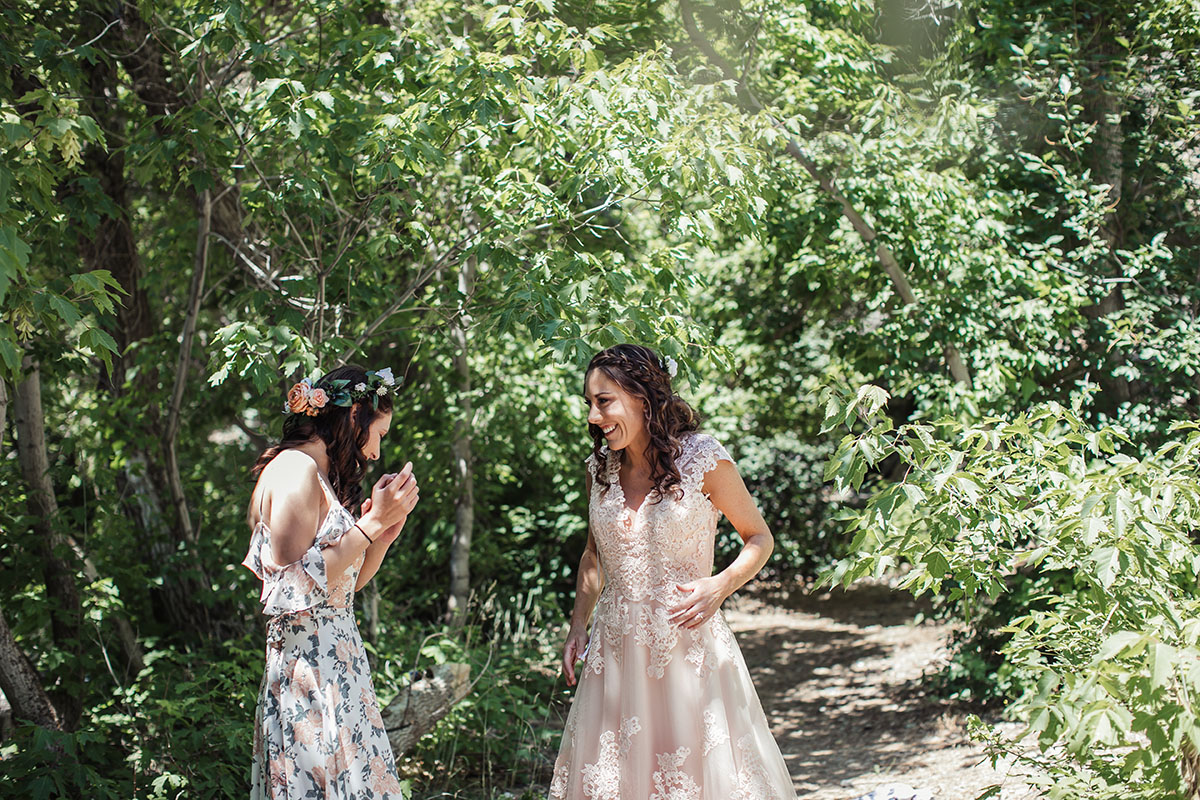 Eclectic bohemian mountain fairytale wedding two brides long tulle champagne dress Lane Bryant outfit flowers nature