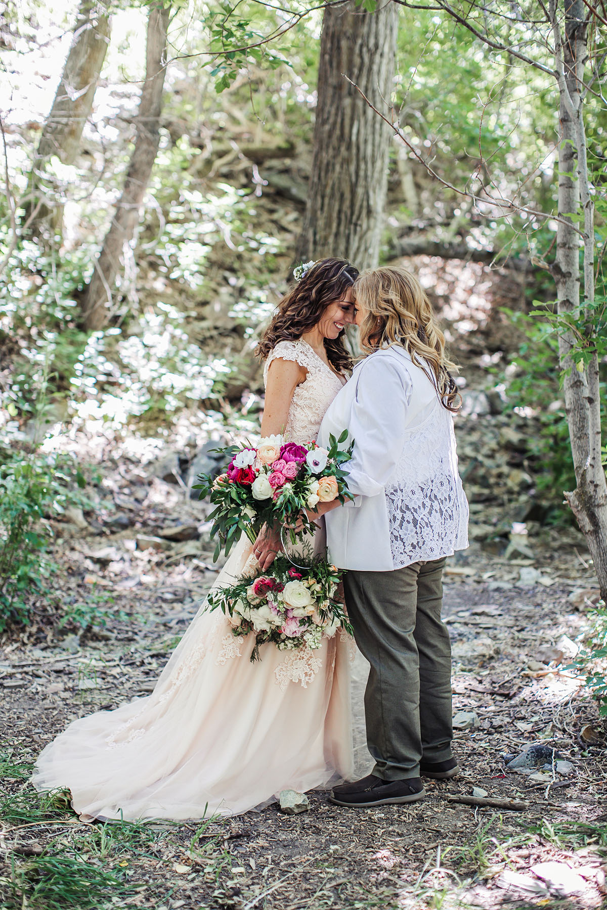 Eclectic bohemian mountain fairytale wedding two brides long tulle champagne dress Lane Bryant outfit flowers nature