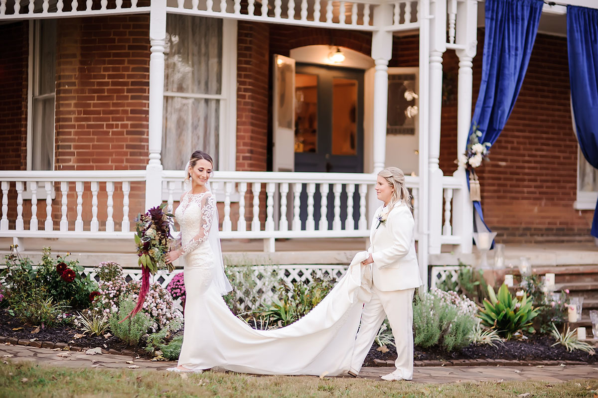 Fall fairytale wedding at a Victorian manor two brides long white lace dress white tux navy wine Tennessee train