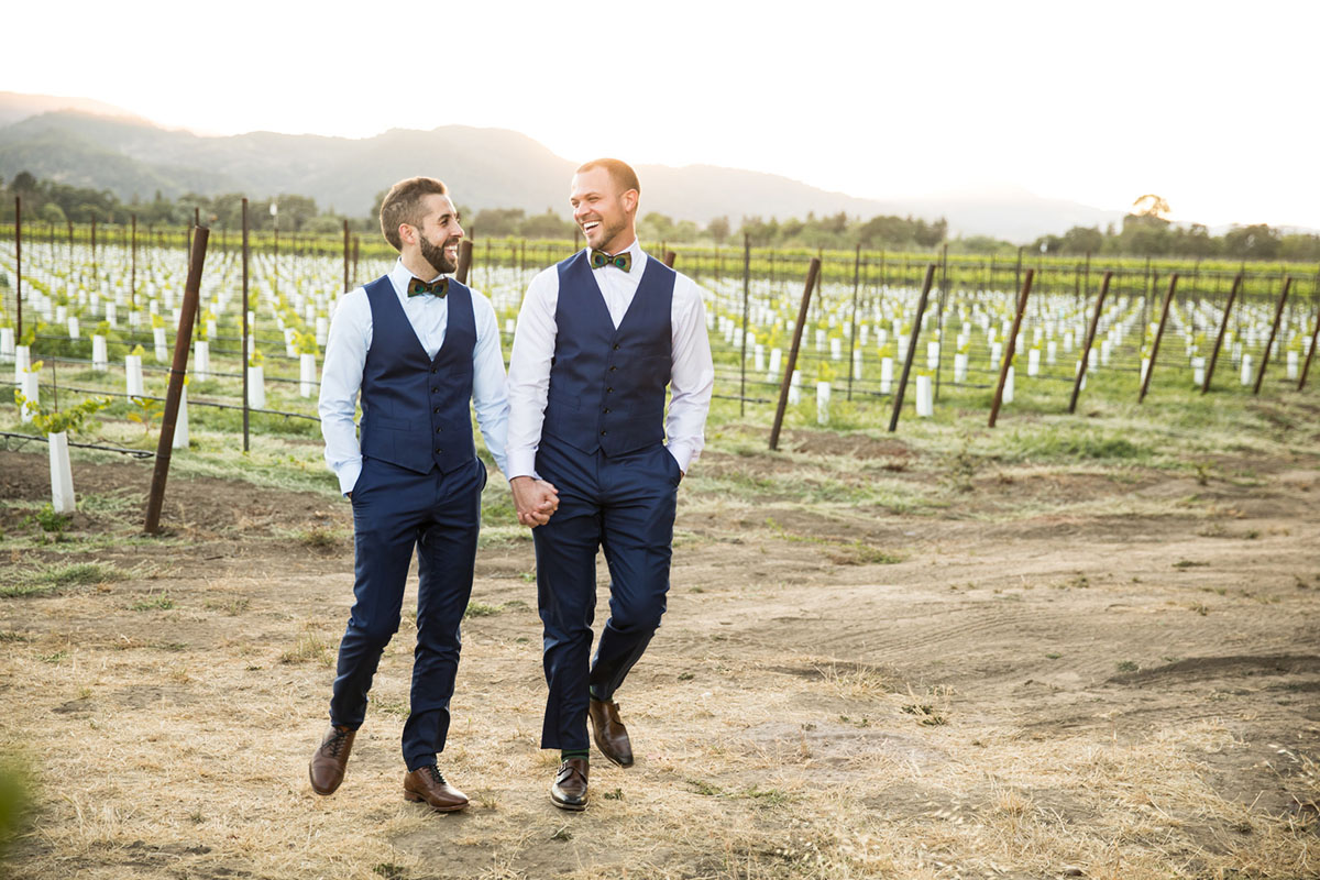Colorful vineyard wedding in Napa Valley, California two grooms blue tux peacock bow tie whimsical mountains outdoor