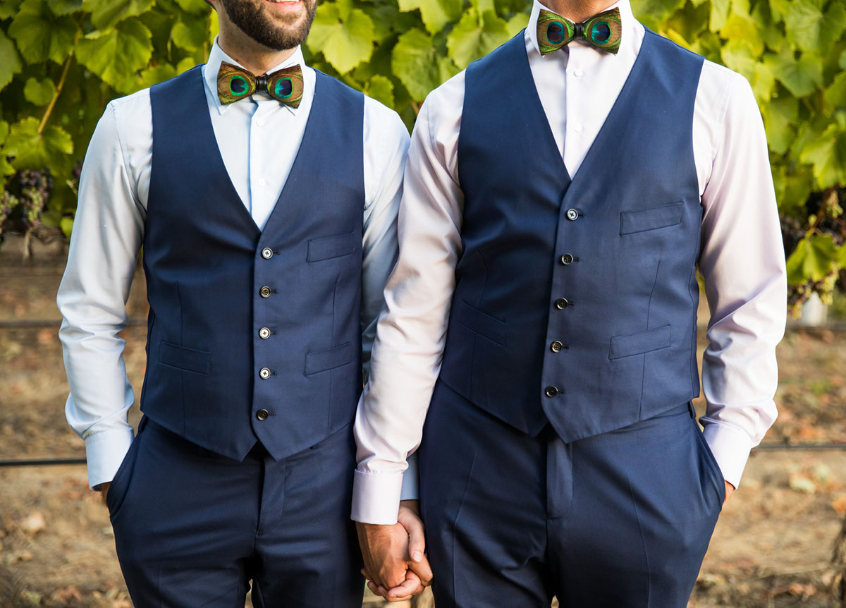 Colorful vineyard wedding in Napa Valley, California two grooms blue tux peacock bow tie whimsical mountains outdoor