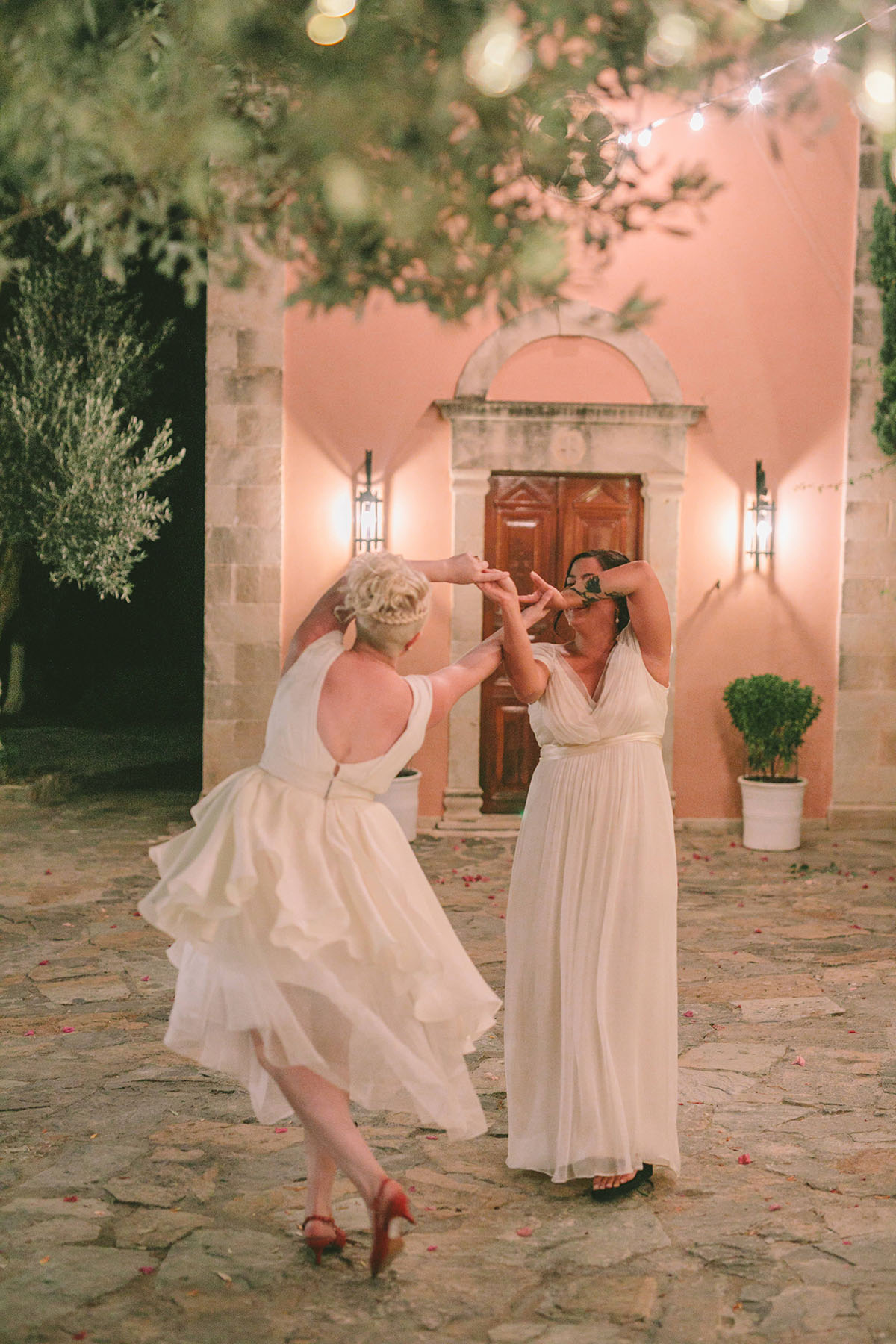 Natural beauty shines in luxury destination wedding in Crete, Greece two brides lesbian wedding nature outdoors greenery hills first dance