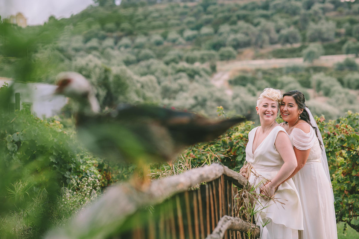 Natural beauty shines in luxury destination wedding in Crete, Greece two brides lesbian wedding nature outdoors greenery hills