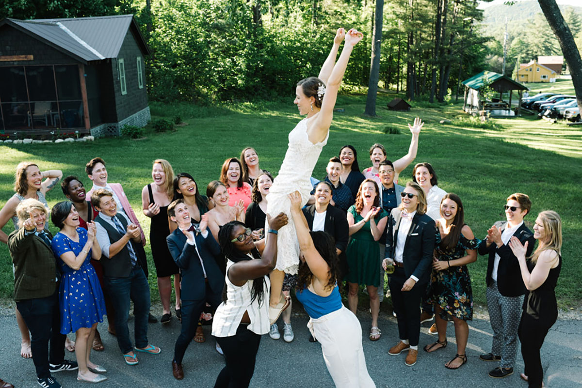 Summer camp wedding in the Adirondack Mountains two brides upstate New York forest mountains Forest Lake Camp Bindle and Keep BHLDN bow tie