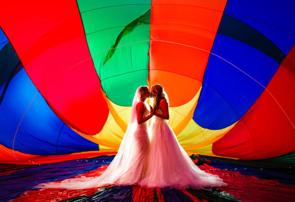 This travel-inspired hot air balloon elopement will seriously lift your heart two brides Sophia Tolli Stella York white dresses tattoos