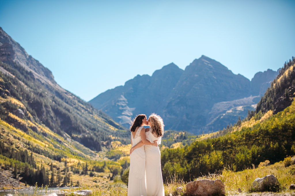 Intimate Elk Mountains wedding in Aspen, Colorado two brides bohemian mountain elopement white dresses