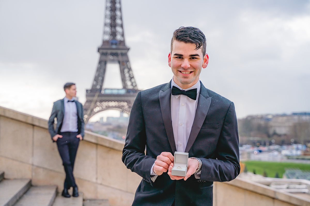 This couple lived their dream proposal in front of the Eiffel Tower in Paris two grooms black tie tuxedos bow ties France engagement