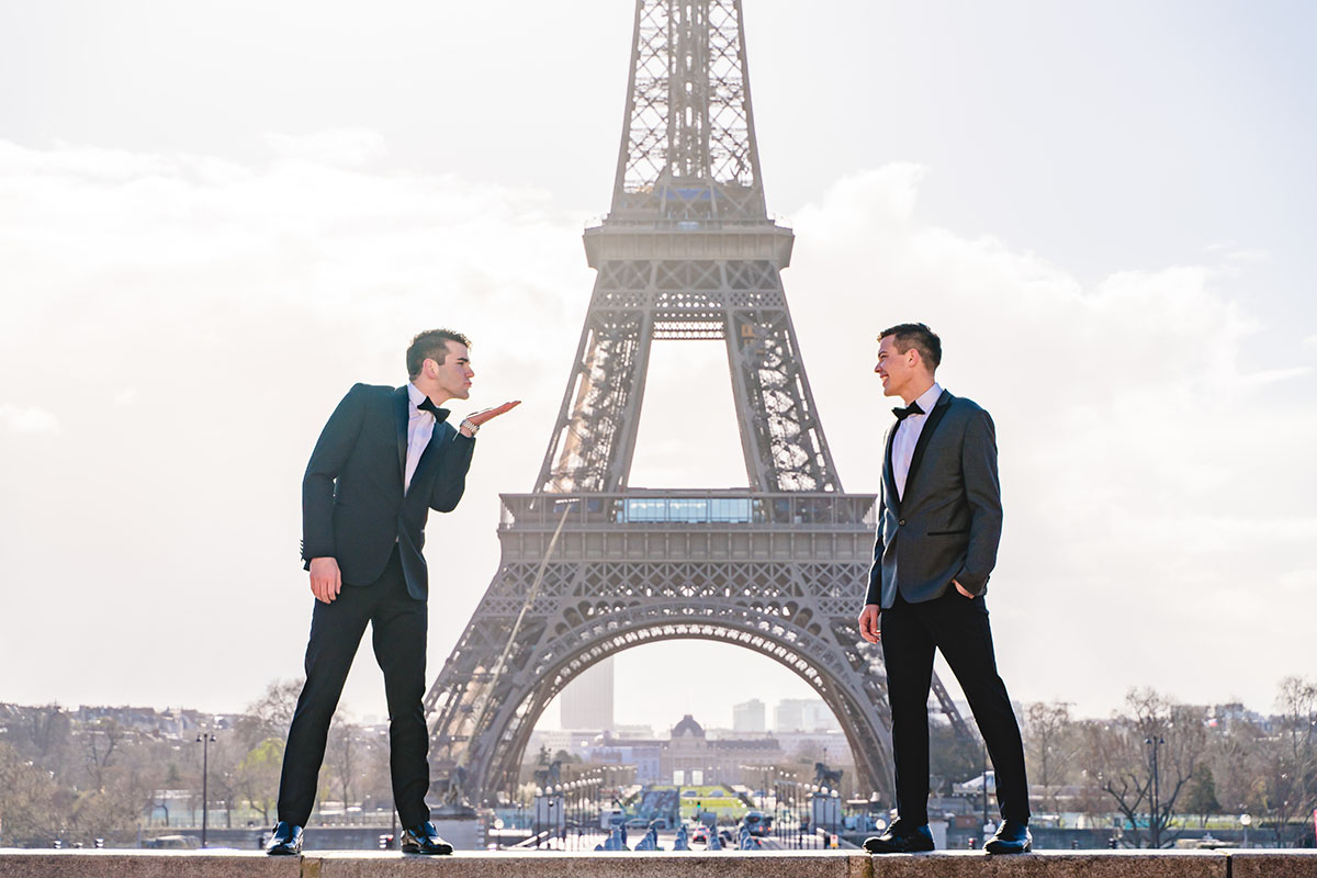This couple lived their dream proposal in front of the Eiffel Tower in Paris two grooms black tie tuxedos bow ties France engagement