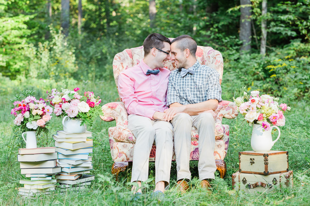 This English garden literary wedding inspiration is directly out of a fairy tale pink purple two grooms books tea macarons plush chair bow ties