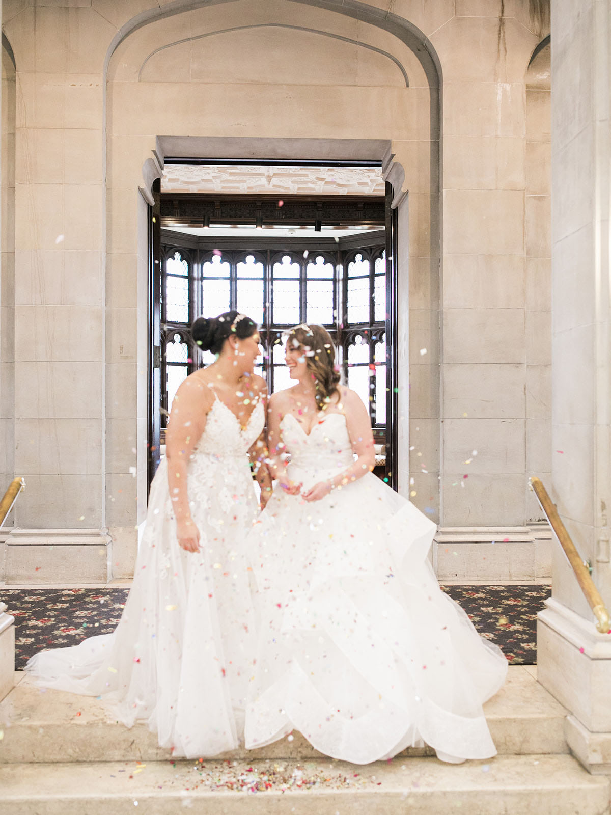 This romantic spring castle wedding is fit for a princess—or two two brides white lace dresses florals crystals diamonds glitter