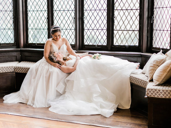 This romantic spring castle wedding is fit for a princess—or two two brides white lace dresses florals crystals diamonds
