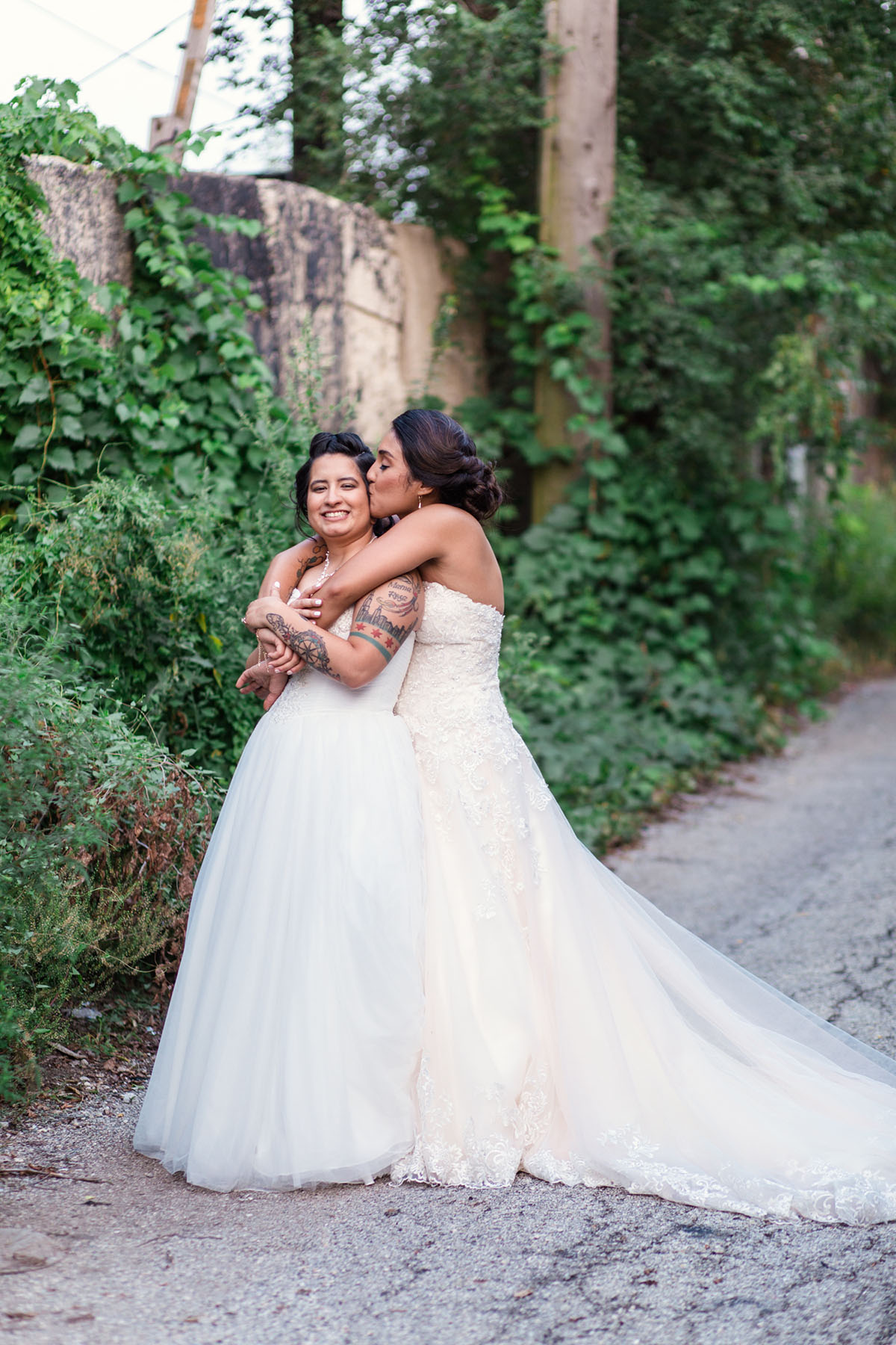 Colorful summer nature-inspired loft wedding in Chicago, Illinois two brides lesbian wedding urban industrial David's Bridal dresses sunflower bright bouquets DIY