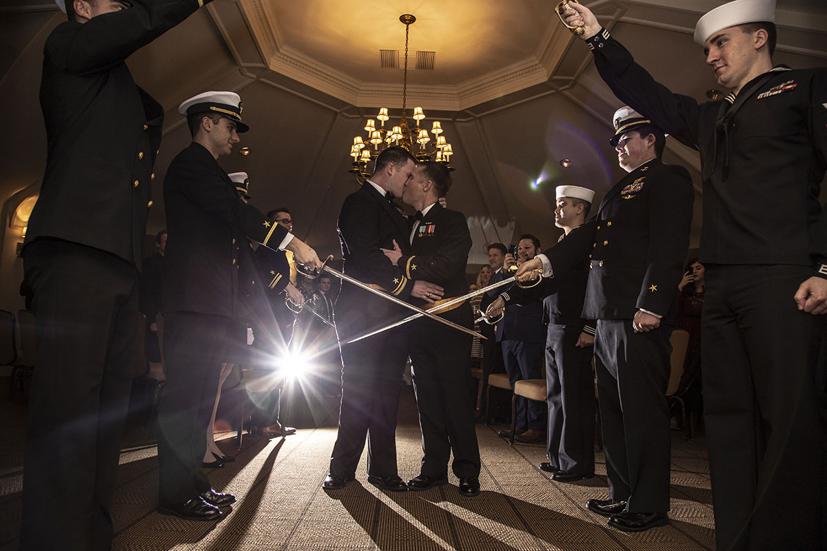 Glamorous 1920s themed wedding with an epic drag reception two grooms gay military wedding swords