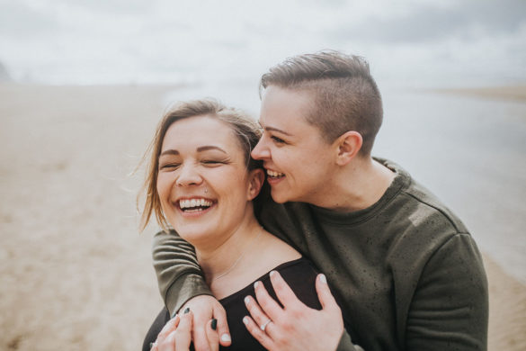 Romantic beach engagement photos on the Oregon Coast two brides Cannon Beach waterfront oceanside