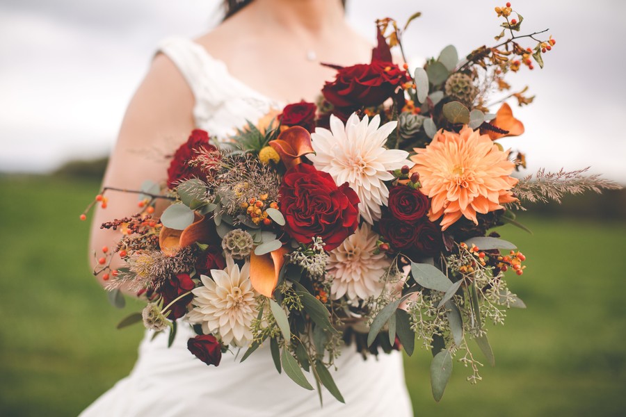 This fall countryside wedding has all the moody, romantic vibes you need two brides lesbian wedding autumn long white dresses bouquet