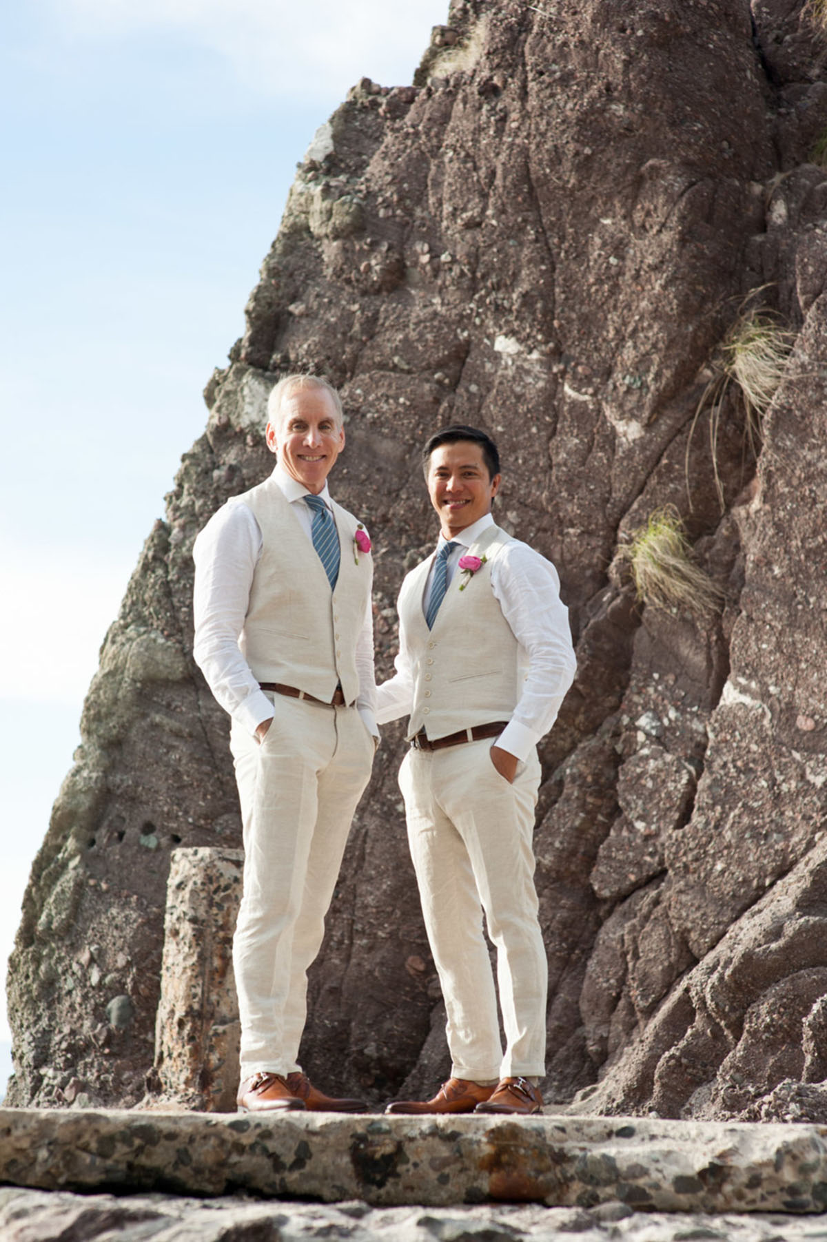 Tropical destination white beach wedding in Puerto Vallarta, Mexico two grooms linen tailored suits tradition whimsical