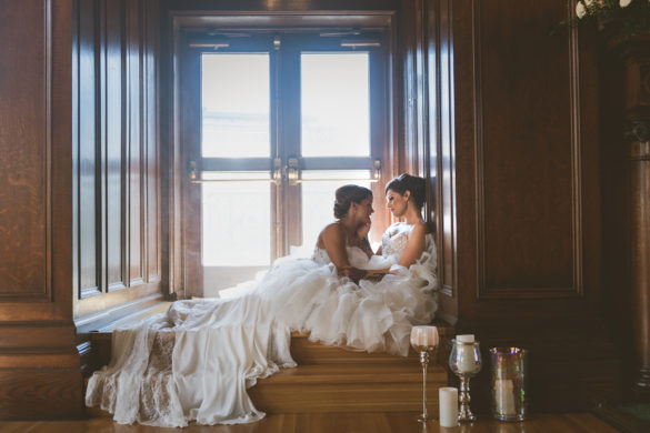 Tropical vintage wedding inspiration in Victoria, British Columbia two brides lesbian wedding tattoos tulle white wedding dress window seat