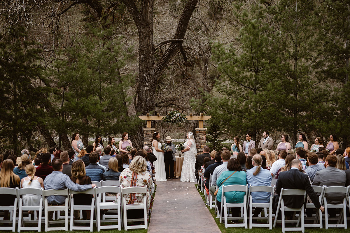 Elegant, woodsy mountain wedding in Boulder, Colorado lesbian spring wedding long white dresses vows