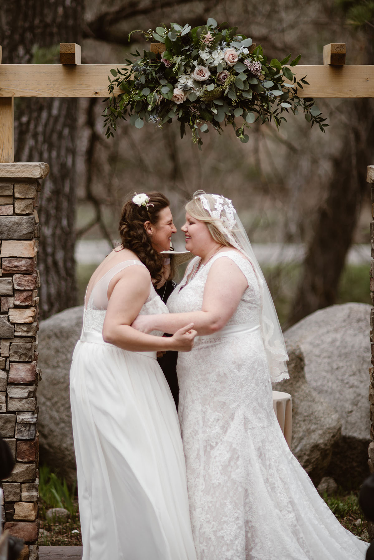 Elegant, woodsy mountain wedding in Boulder, Colorado lesbian spring wedding long white dresses vows