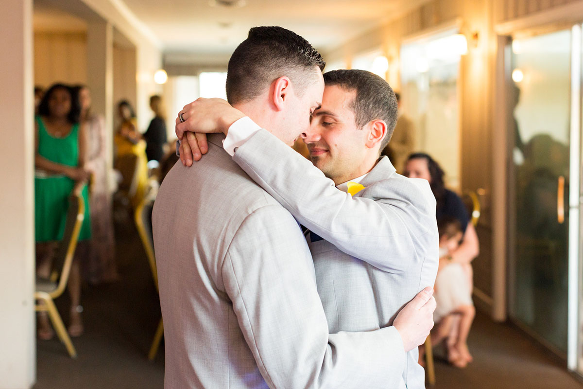 Blue and yellow spring wedding at the Lake Country Club two grooms gay wedding gray tuxes dance