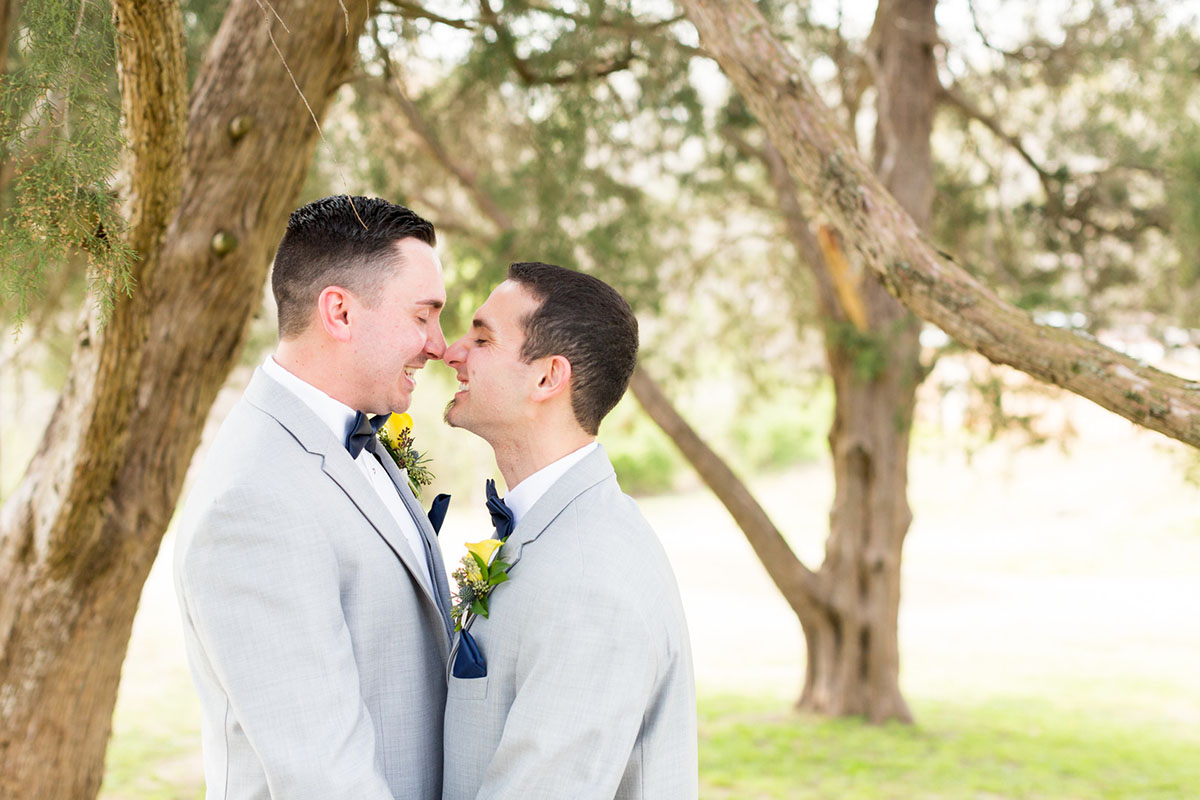 Blue and yellow spring wedding at the Lake Country Club two grooms gay wedding gray tuxes