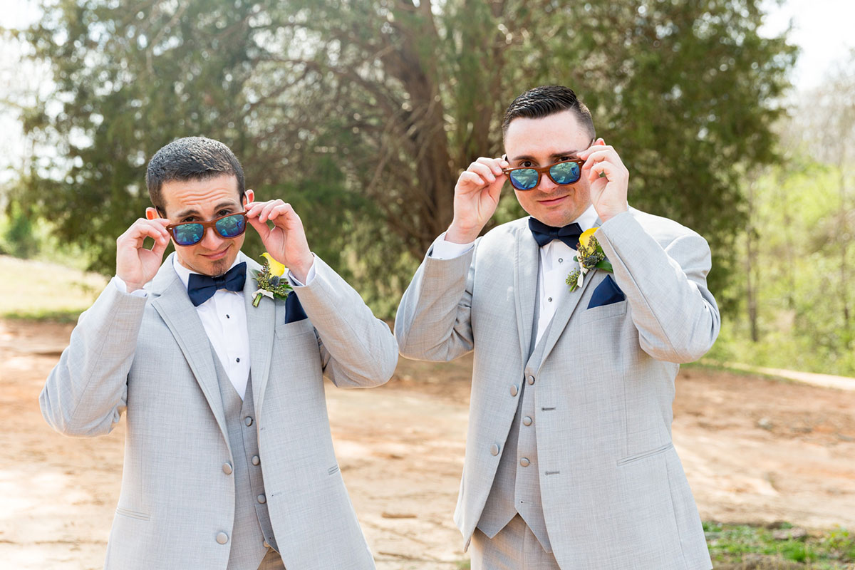 Blue and yellow spring wedding at the Lake Country Club two grooms gay wedding gray tuxes sunglasses