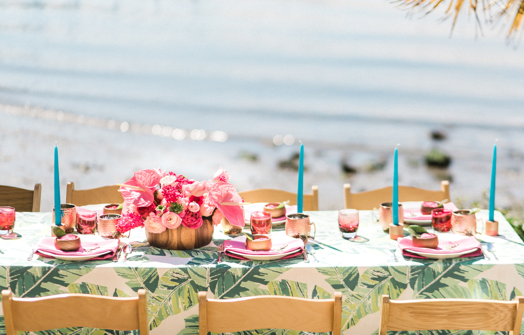 Bright, colorful Lilly Pulitzer spring wedding inspiration two brides palm tree leaves flamingos colorful waterfront table setting