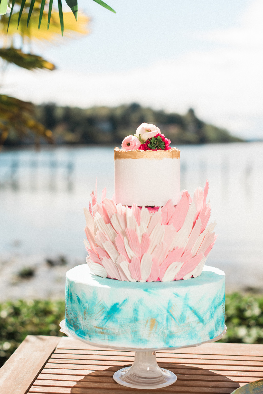 Bright, colorful Lilly Pulitzer spring wedding inspiration two brides palm tree leaves flamingos colorful waterfront cake