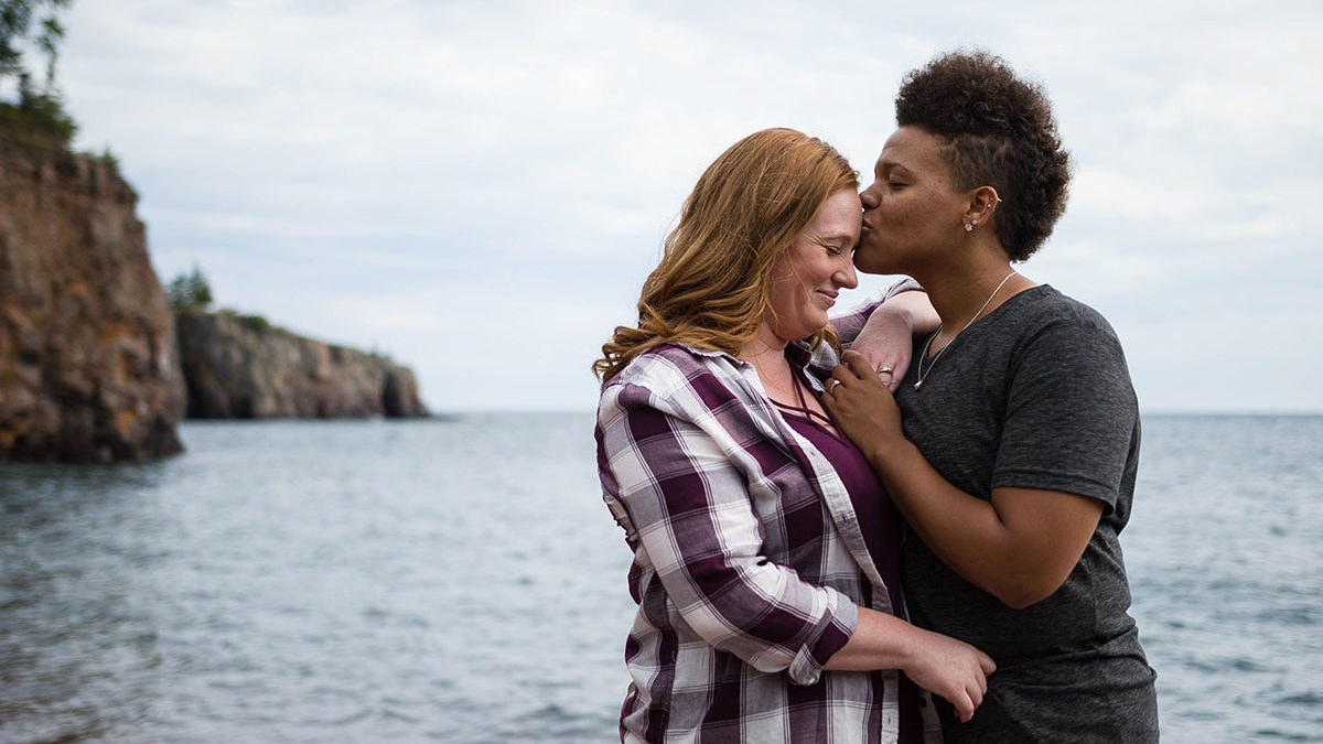 Fun waterfront engagement photos on the coast of Lake Superior