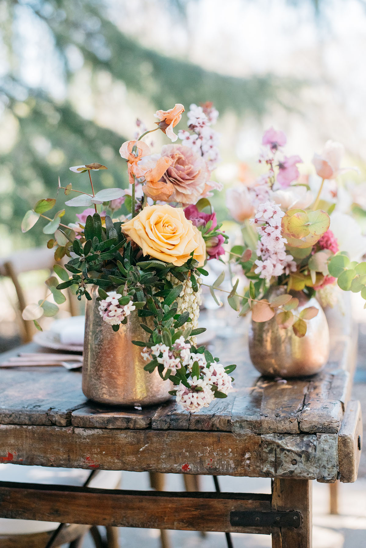 Moody floral fairy tale wedding inspiration with fashion from three eras contemporary vintage modern trans wedding looks dresses hair makeup bridal beauty LGBTQ+ flowers