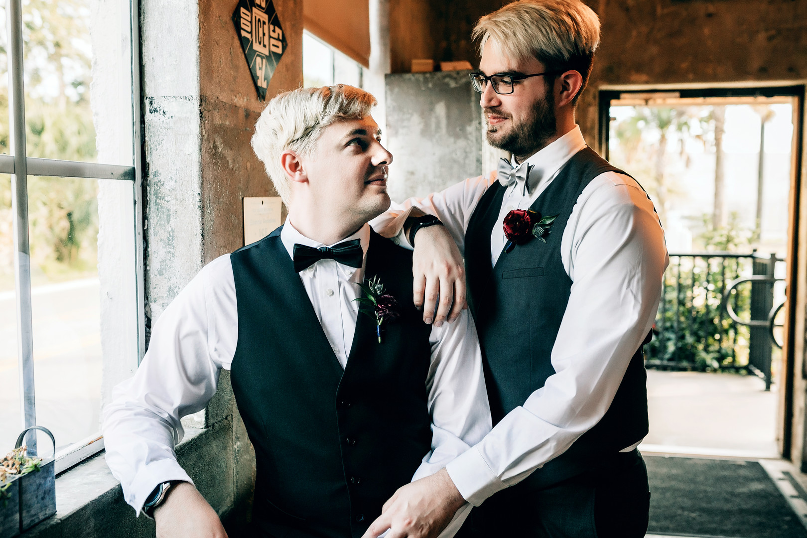 Moody, romantic distillery elopement inspiration two grooms black vests St. Augustine Distillery Florida gay wedding