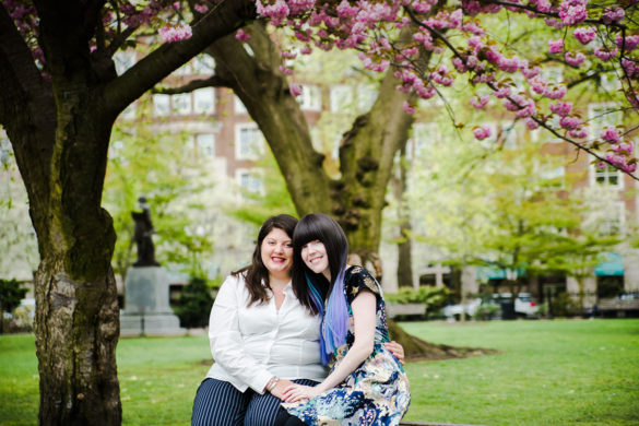 Spring engagement photos in Boston Public Garden two brides blooming trees flowers colorful