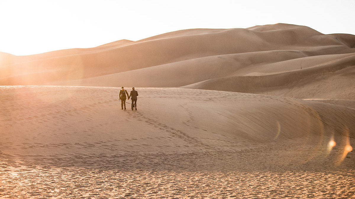 Sunset and sand dunes adventure elopement
