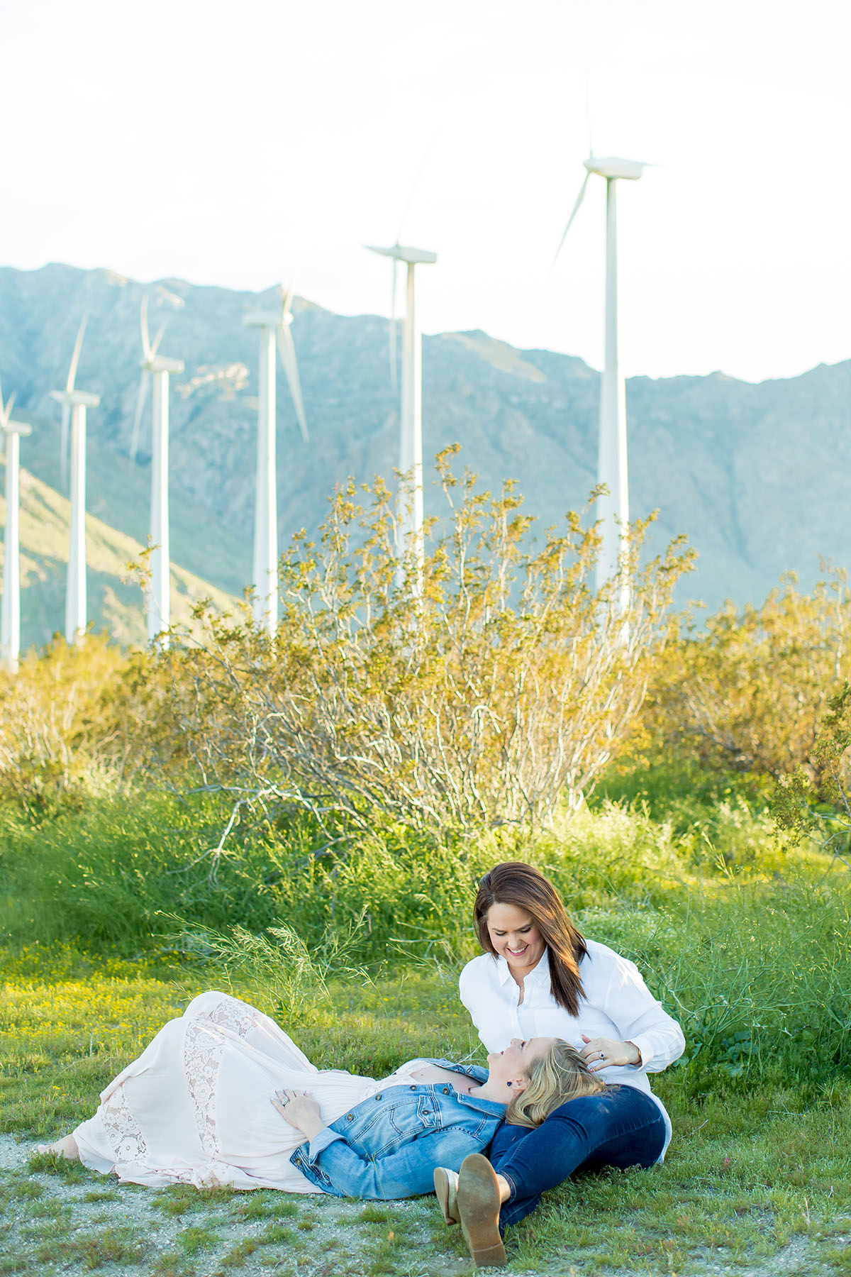 Sunset engagement photos in Palm Springs, California two brides engagement outdoors romantic cuddling