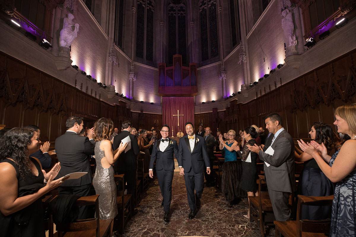 Elegant cathedral wedding in San Francisco, California two grooms black tuxedos just married church